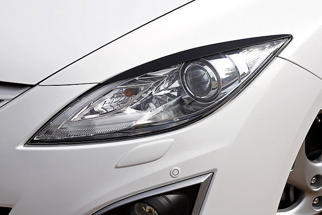 картинка Mazda 6 2010—2012 Накладки на передние фары (реснички) компл.-2 шт. магазин  StreetTuning 